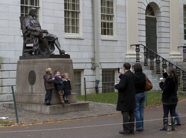 315-0640 Posing with Statue of John Harvard.jpg